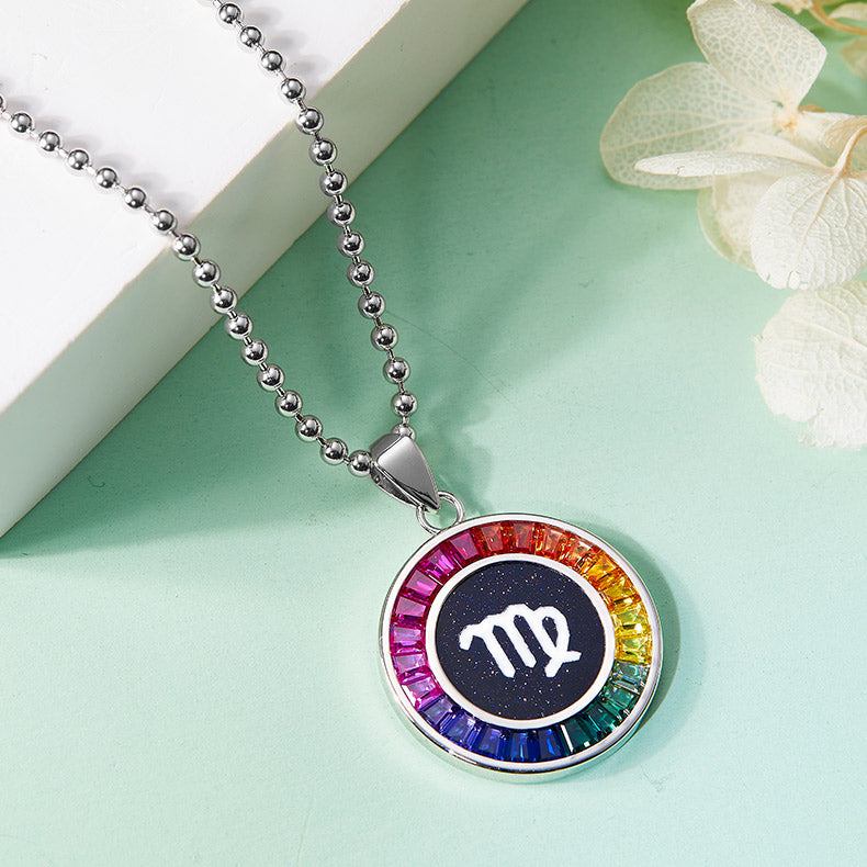Necklace with a colorful virgo zodiac pendant on a light green background
