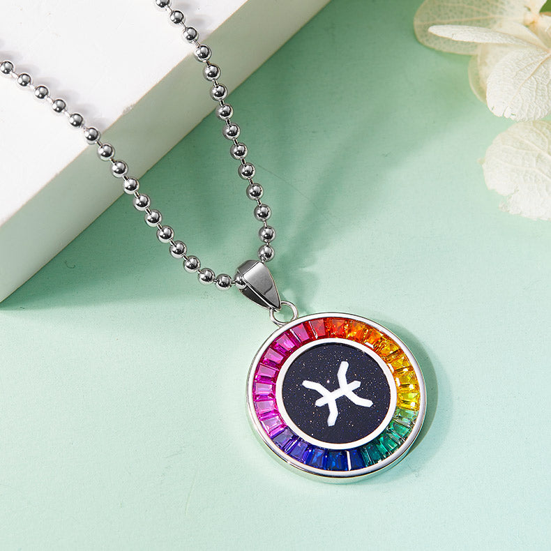Necklace with a colorful Pisces zodiac pendant featuring a star symbol on a light green background