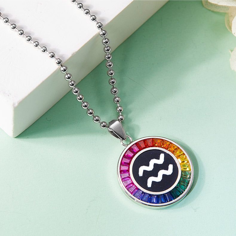 Necklace with a colorful Aquarius zodiac pendant on a light green background