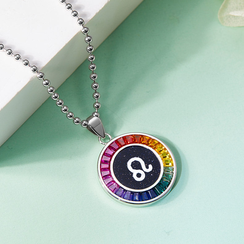 Necklace with a colorful leo zodiac pendant on a light green background