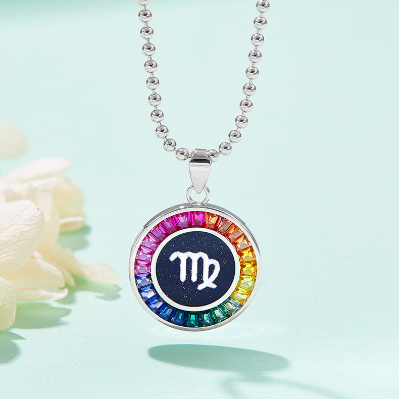 Necklace with a colorful virgo pendant featuring the Virgo symbol on a light blue background