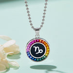 Necklace with a colorful Capricorn Zodiac pendant on a light blue background