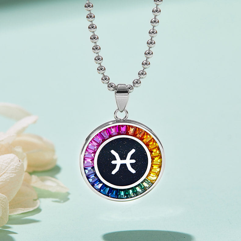 Necklace with a colorful  Pisces zodiac pendant on a light blue background