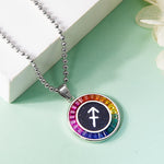 Necklace with a colorful Sagittarius Zodiac pendant featuring a symbol on a light green surface.