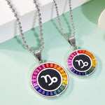 Two necklaces with Capricorn Zodiac symbol pendants on a light green background