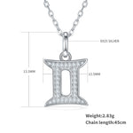 Silver necklace with Gemini zodiac pendant and measurement details on a white background
