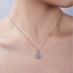Necklace with a pendant on a model against a neutral background