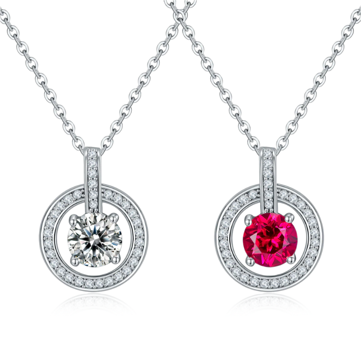 Two silver pendants with gemstones on a white background