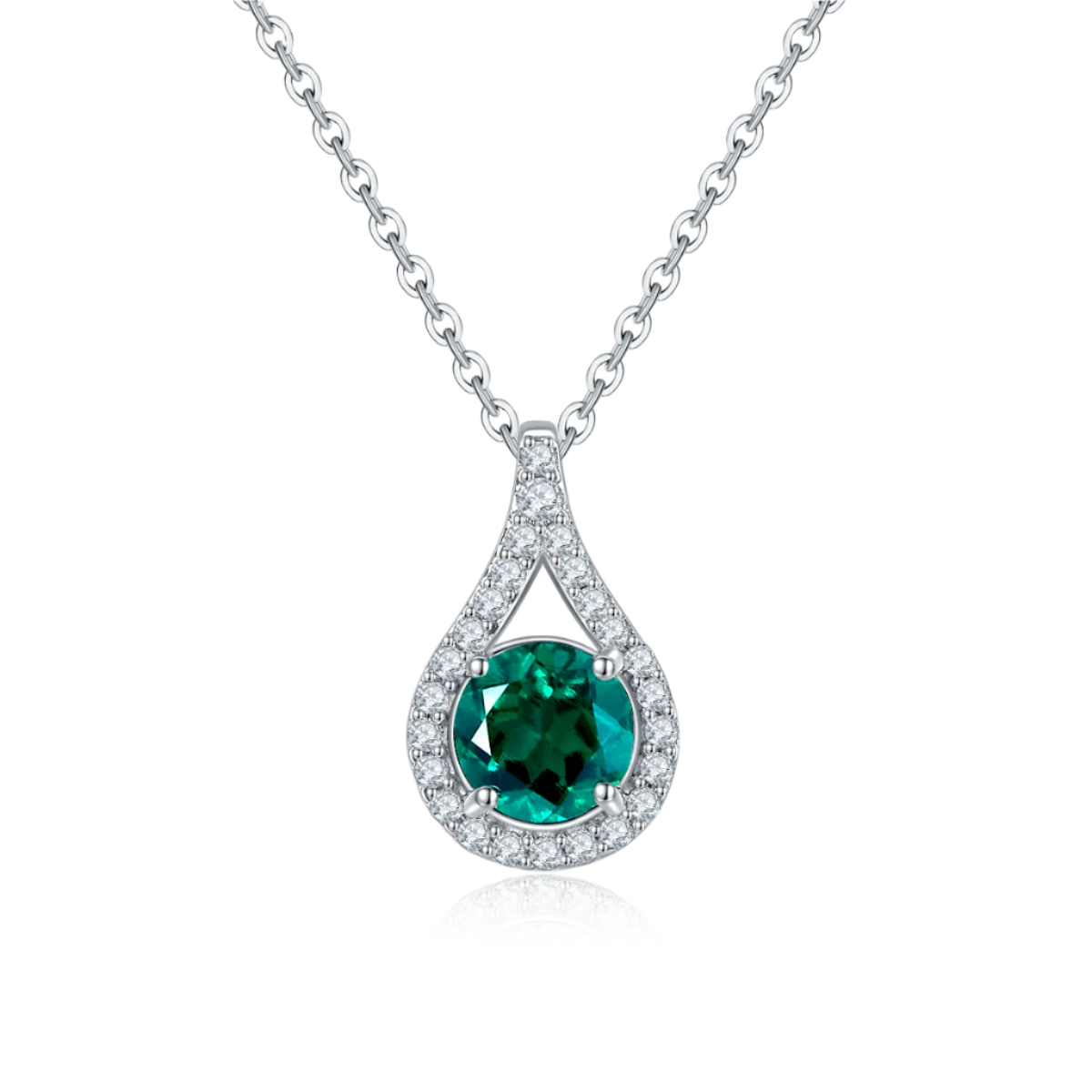 Teardrop-shaped pendant with green gemstone and diamond accents on a white background