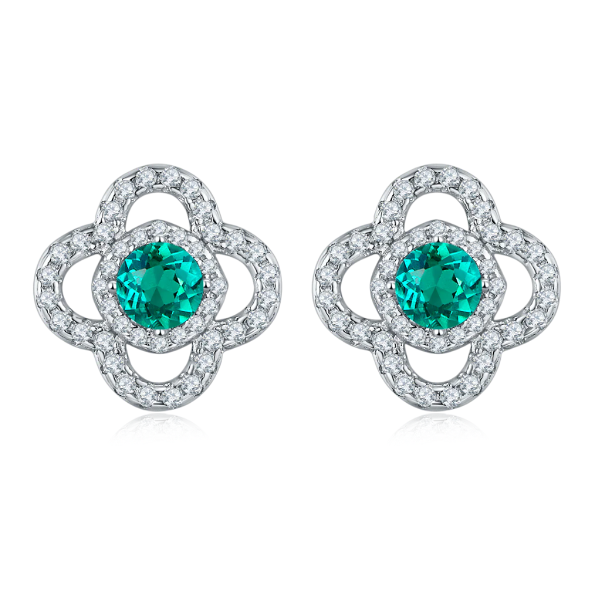 Pair of silver earrings with green emerald gemstones on a white background