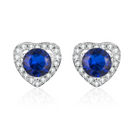 Heart-shaped earrings with blue gemstones and clear stones on a white background