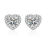 Heart-shaped earrings with clear gemstones on a white background