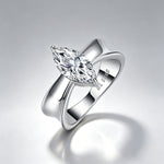 3CT marquise moissanite engagement ring on a soft grey background