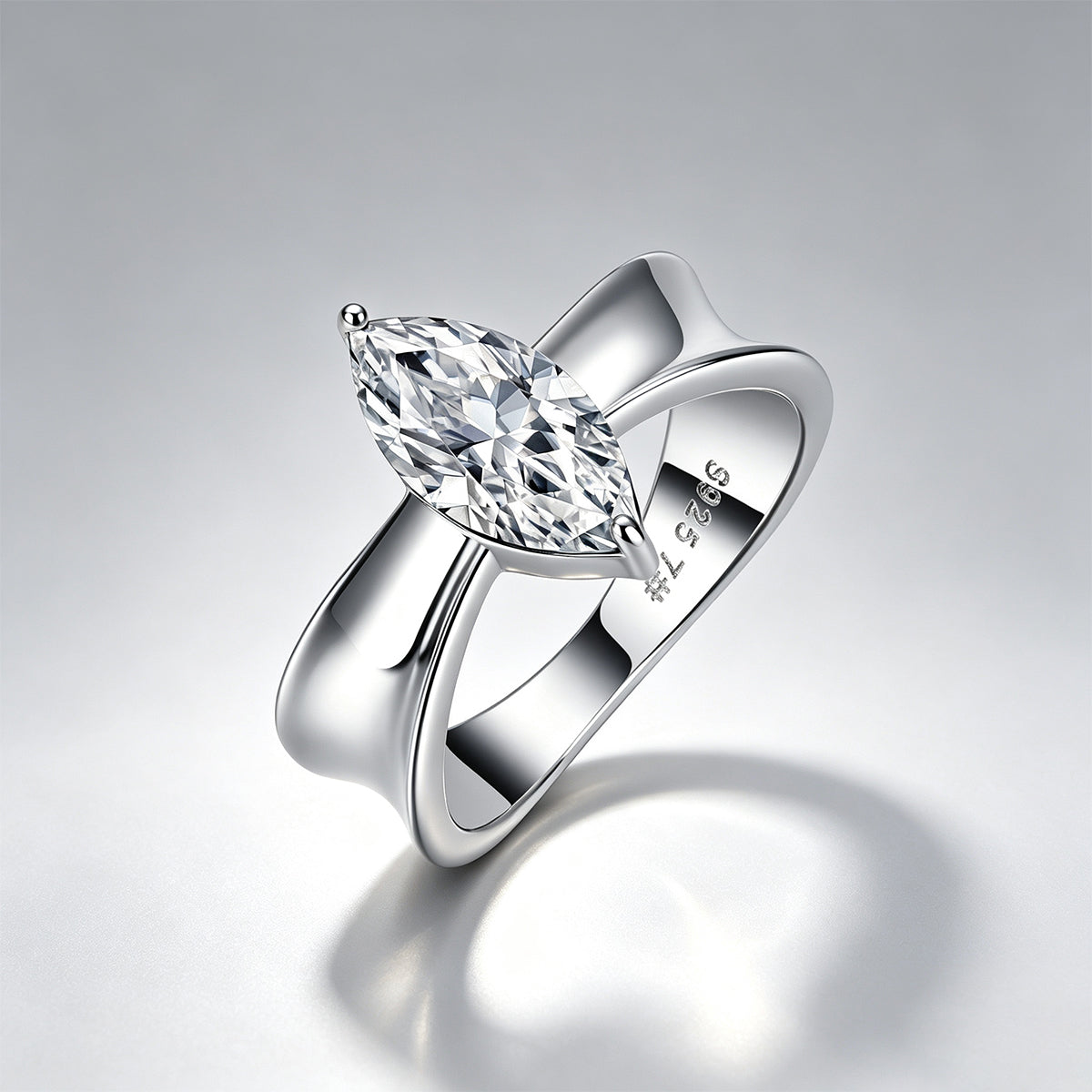 3CT marquise moissanite engagement ring on a soft grey background