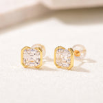 Asscher-cut stud earrings in yellow gold-plated finish, angled view