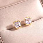 Asscher-cut studs in yellow gold-plated finish on fabric
