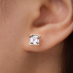 Asscher-cut yellow gold-plated stud shown on ear