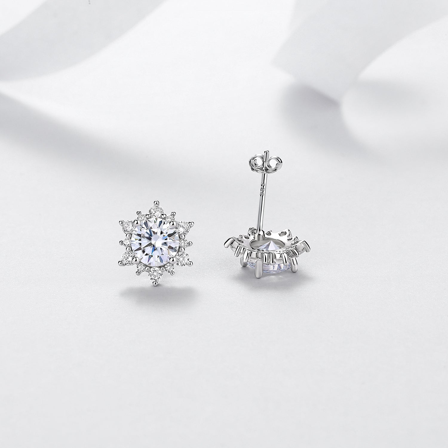 Round moissanite halo stud earrings showing front, side, and butterfly back