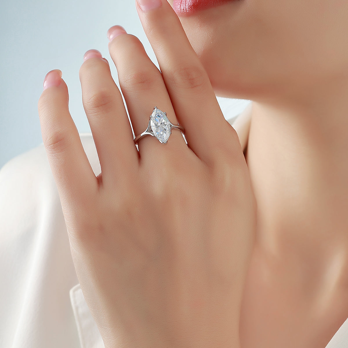 Marquise moissanite solitaire ring shown on hand