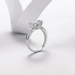 Radiant-cut moissanite engagement ring showing side profile and setting