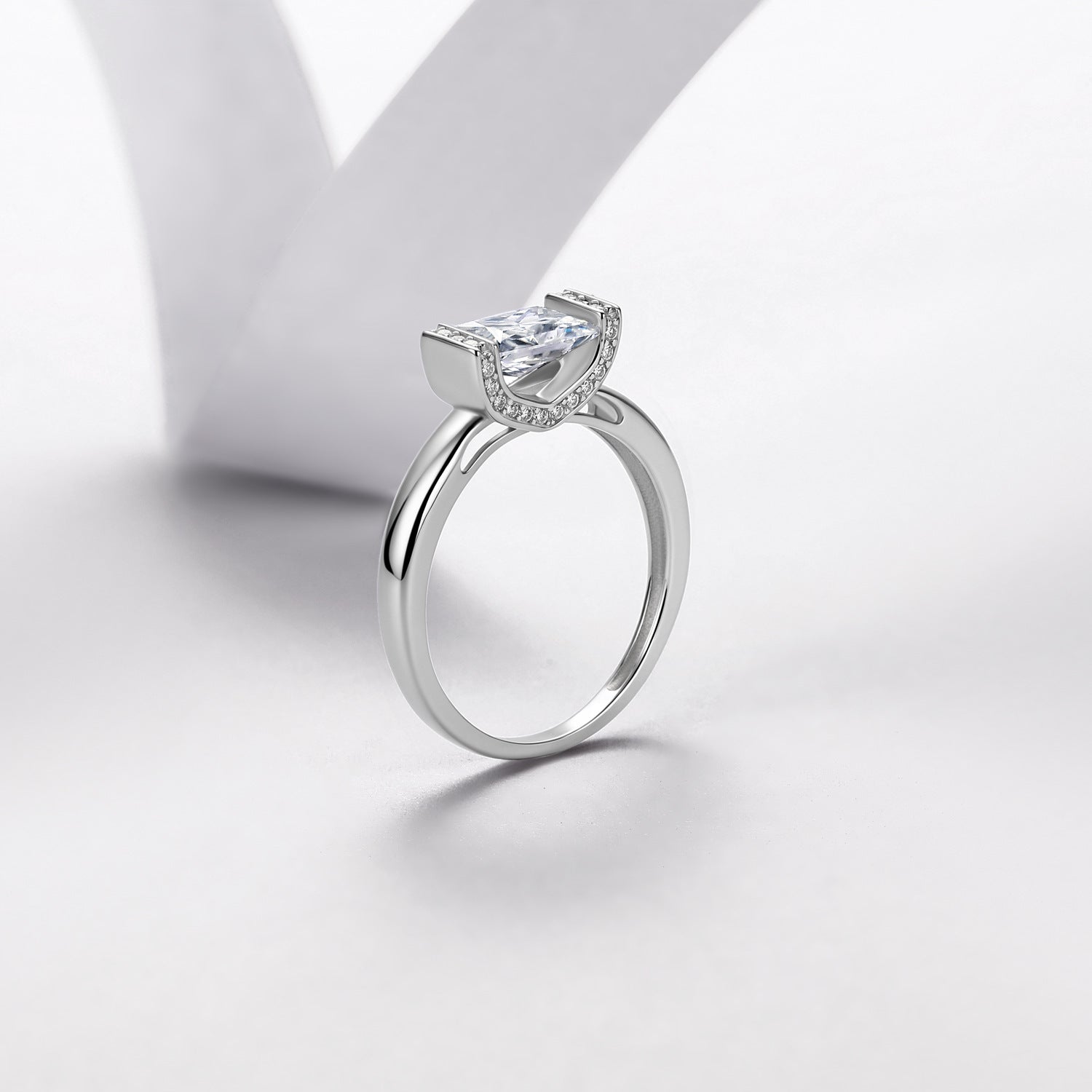 Radiant-cut moissanite engagement ring showing side profile and setting