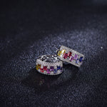 Rainbow gemstone and moissanite hoop earrings, angled pair