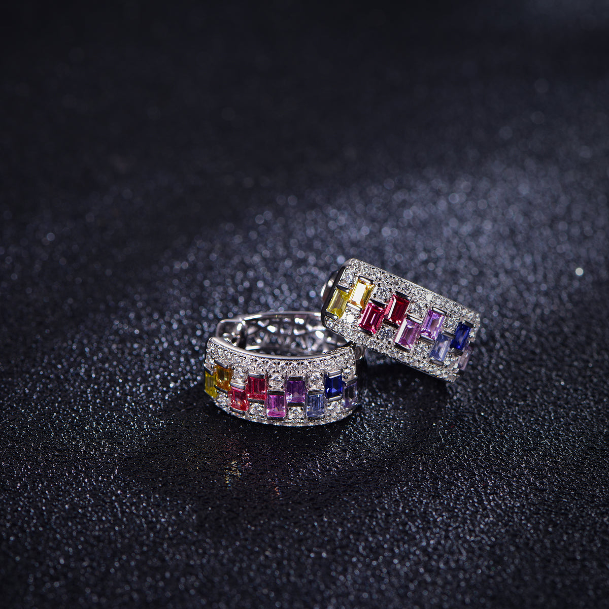 Rainbow gemstone and moissanite hoop earrings, angled pair